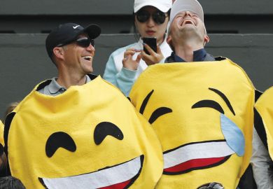 Two men wearing emoji costumes laughing asametaphor for Is optimism justified?
