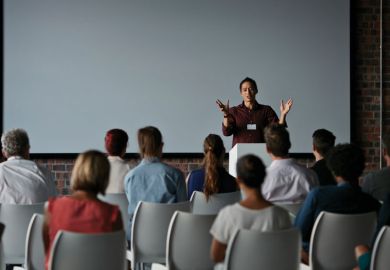People at a lecture for University leaders more wedded to lectures than before Covid