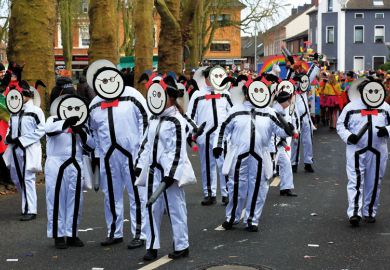 Group of people in same costume wearing same smiling mask. Group of people in same costume wearing same smiling mask as a metaphor for a tool using facial and keystroke recognition has been launched.
