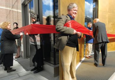 giant red ribbon encircling the Bowdoin College Museum of Art’s new building during a ribbon cutting ceremony  people cutting ribbon with adults holding it around them as a metaphor for what I've missed about my former life