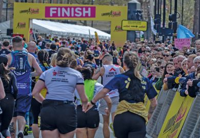 Runners holding hands approach the finish line at the London Landmarks Half Marathon 2024 Runners holding hands approach the finish line at the London Landmarks Half Marathon 2024 to illustrate record numbers are getting clearing for university admissions