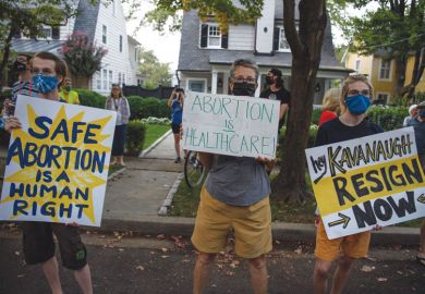 Abortion rights activists protest outside the house of US Supreme Court Justice Brett Kavanaugh in  Chevy Chase Maryland, on September 13, 2021 as illustrated for the Abortion ban to hurt Texas’ universities