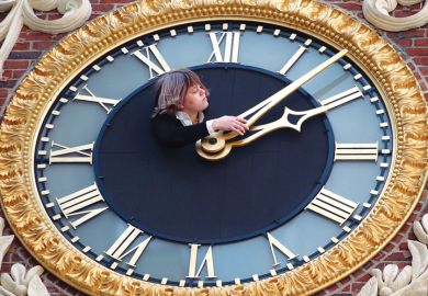 Lady adjusts the clock at the top of the Old State House to illustrate Students ‘could save £40K’ if they cancel gap years before reforms