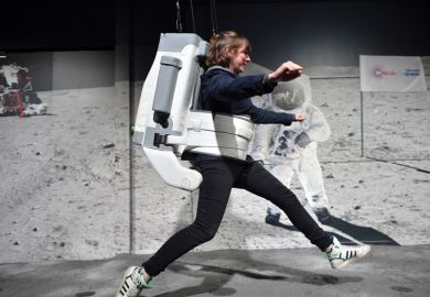 A visitor uses a space simulator during the opening of the Astronauts US bets big on entrepreneurial science exhibition to illustrate 