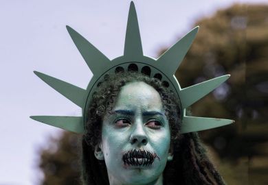 A protester dresses as the Statue of Liberty with stitches over her mouth to illustrate Chicago Principles put to the test in US