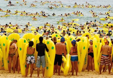 Beachgoers ride on inflatables with some waiting to go into the sea in Sydney, Australia Beachgoers ride on inflatables with some waiting to go into the sea in Sydney, Australia to illustrate Two-step grant applications ‘will transform’ Australian research