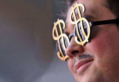 A man wears dollar shape glasses A man wears dollar shape glasses to illustrate US public universities refute claim they are amply funded