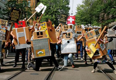 people dressed in boxes with banners as robots