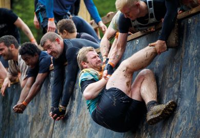 people helping each other to climb wall people helping each other to climb wall