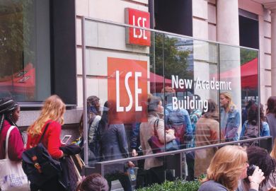 Students attending the London School of Economics and Political Science outside the university's New Academic Building, London, UK.