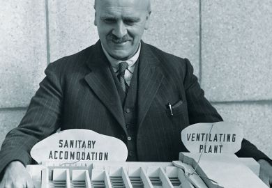 John Burdon Sanderson Haldane (1892-1964) the Scottish geneticist holds an architectural model. 