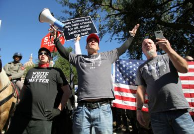 Austin, Texas, USA - November 19, 2016: A group of 'White Lives Matter' demonstrators protest just south of the Capitol grounds Austin, Texas, USA - November 19, 2016: A group of 'White Lives Matter' demonstrators protest just south of the Capitol grounds
