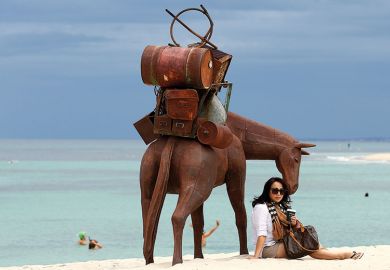 woman and horse on beach