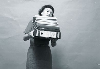 woman carrying files woman carrying files