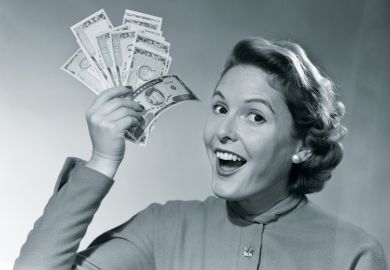 Woman holding handful of cash (black and white)