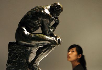 Woman looking at The Thinker sculpture, Auguste Rodin, Beijing World Art Museum Woman looking at The Thinker sculpture, Auguste Rodin, Beijing World Art Museum