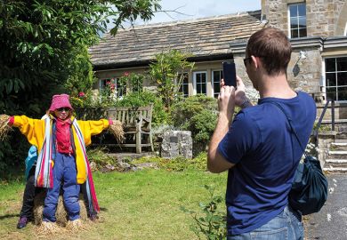 Woman pretends to be a scarecrow