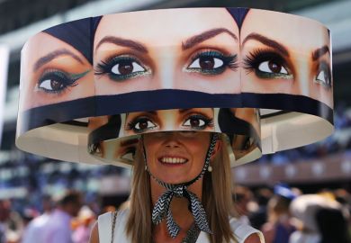 Woman wearing hat, Meydan Racecourse, Dubai World Cup Woman wearing hat, Meydan Racecourse, Dubai World Cup