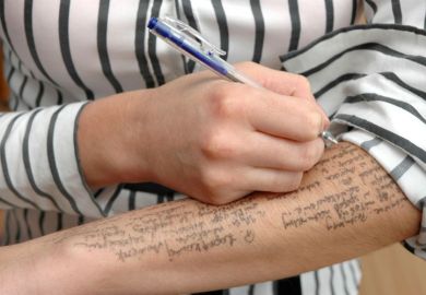 Exam cheating, woman writing notes on arm