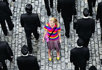 Young woman in a crowd of people in black suits Young woman in a crowd of people in black suits illustrating feature article about US undergraduate university system