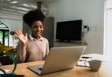 Woman working from home, on a video call with work colleagues