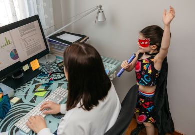Woman working from home with her daughter singing by her side
