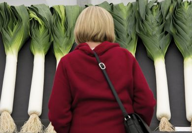 A woman looking at leeks
