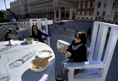Women sitting at giant table