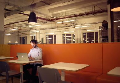 Man working on laptop alone