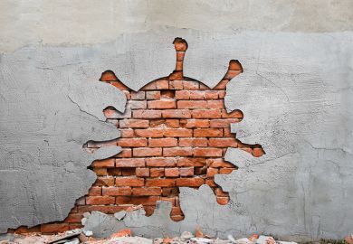 wrecking ball Image of coronavirus-shaped hole in a brick wall
