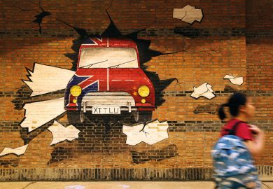 A student passes by an underpass with mural paintings at Xi'an Jiaotong Liverpool University in Suzhou, Jiangsu Province of China. Illustrates how China’s joint ventures with foreign universities could remain A student passes by an underpass with mural paintings at Xi'an Jiaotong Liverpool University in Suzhou, Jiangsu Province of China. Illustrates how China’s joint ventures with foreign universities could remain