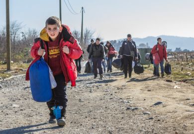Young boy leads caravan of Syrian refugees Young boy leads caravan of Syrian refugees