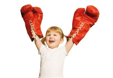Young girl celebrating boxing victory