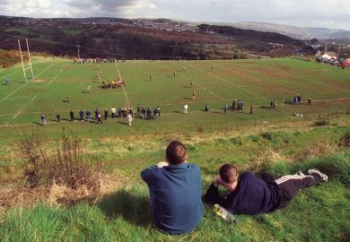 Young men watching rugby match, Cefn coed RFC
