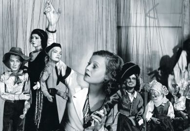 Young woman playing with puppets Young woman playing with puppets