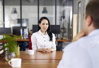 Young Asian woman being interviewed