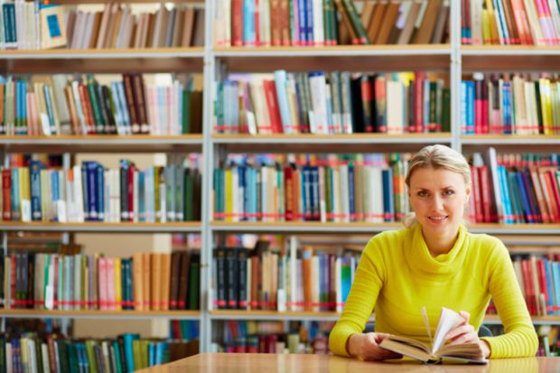 A woman sitting in a library A woman sitting in a library
