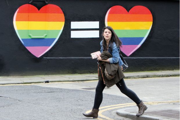 Woman walks past mural in favour of same-sex marriages Woman walks past mural in favour of same-sex marriages