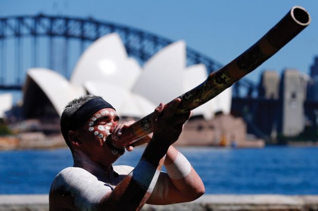 Aboriginal man plays didgeridoo, Sydney Opera House, Australia Aboriginal man plays didgeridoo, Sydney Opera House, Australia