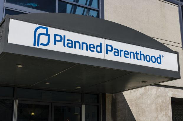 An abortion clinic illustrating an opinion article by Edward C. Halperin about reproductive rights and academic freedom