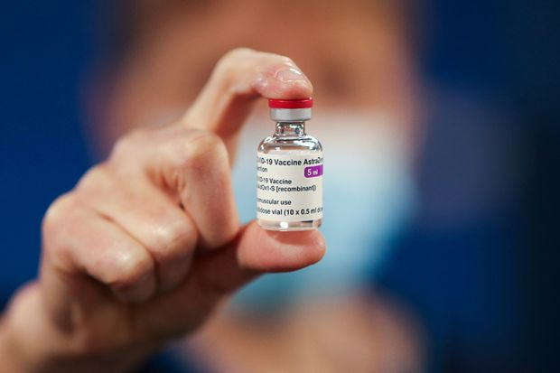 A healthcare worker holds a vial of AstraZeneca coronavirus disease (COVID-19) vaccine at the Pentland Medical Practice  on 7 January 2021 in Currie, Scotland.