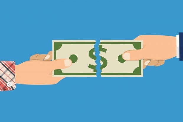 A dollar bill being torn