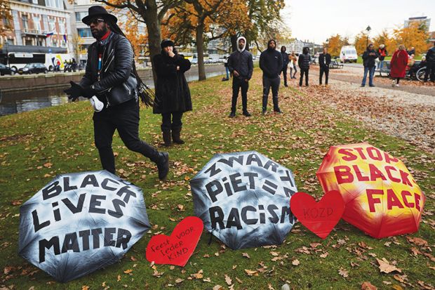 Human rights activists attend a rally against blackface characters during the Saint Nicholas parade in The Hague, Netherlands, 2019