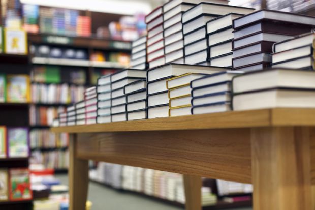 Books on a display table in a bookshop Books on a display table in a bookshop