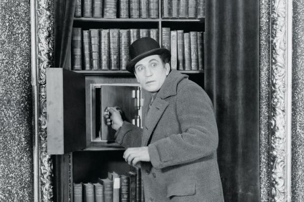 Man breaking into safe Man breaking into safe