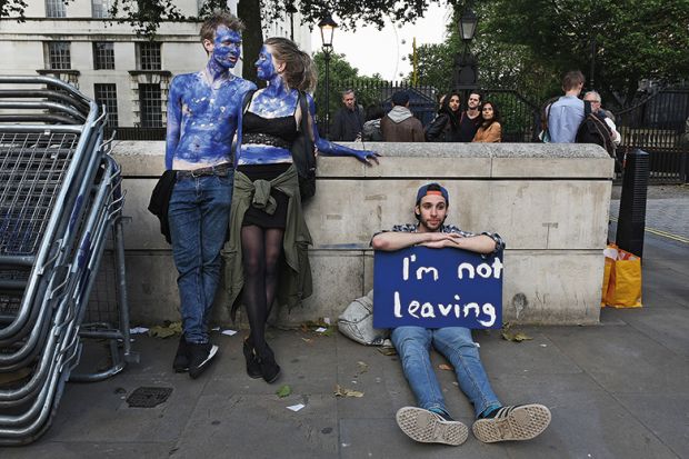 A young couple painted as EU flags protest on outside Downing Street against the United Kingdom's decision to leave the EU following the referendum A young couple painted as EU flags protest on outside Downing Street against the United Kingdom's decision to leave the EU following the referendum