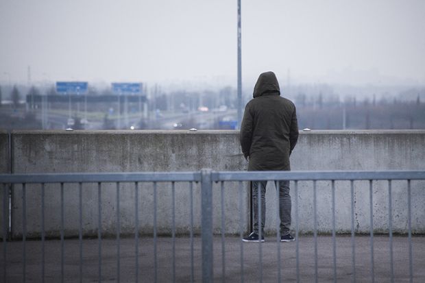 Man on bridge contemplating suicide Four in 10 PhD students ‘at high risk of suicide’