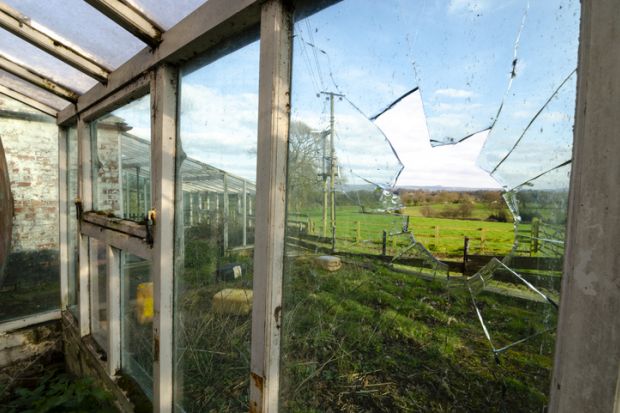 A greenhouse with a broken glass pane, illustrating the threat to academic freedom A greenhouse with a broken glass pane, illustrating the threat to academic freedom