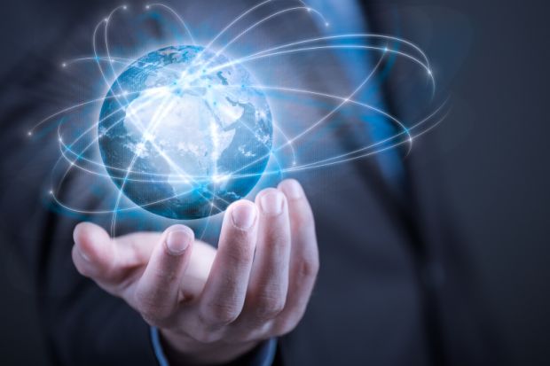 Businessman holding planet Earth in palm Businessman holding planet Earth in palm