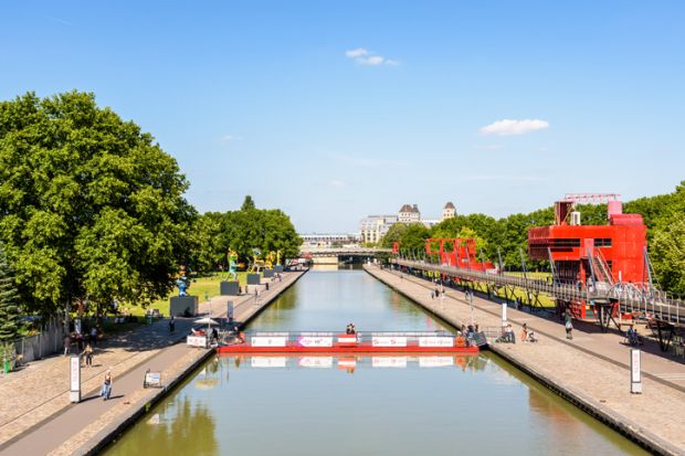 canal de l'Ourcq splitting the parc de la Villette in Paris, France
